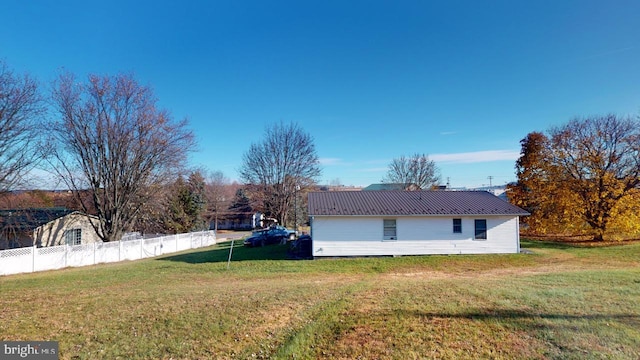 view of home's exterior featuring a yard