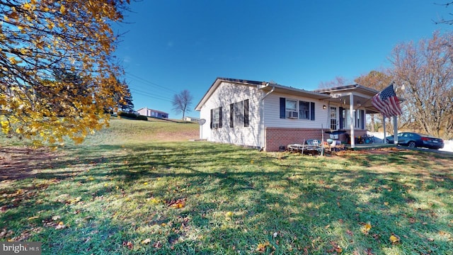 view of property exterior with cooling unit and a lawn