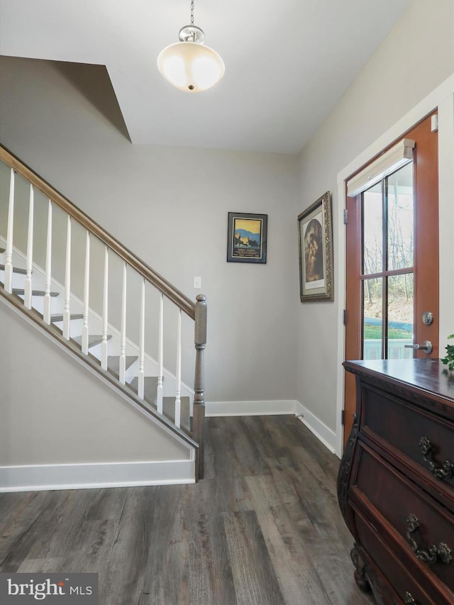 1150 Lewisville Rd, Berryville, VA 22611 - entrance foyer with dark wood finished floors, baseboards, and stairway