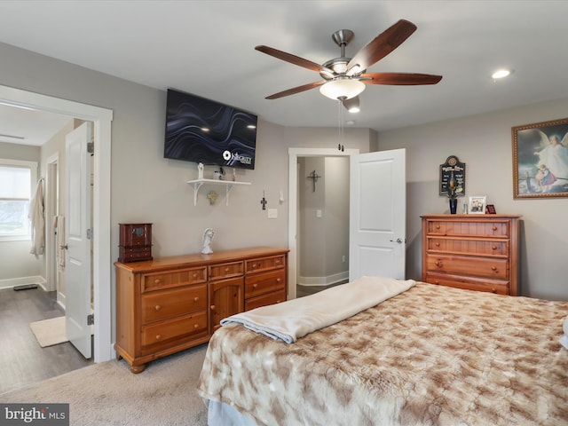 bedroom featuring hardwood / wood-style floors and ceiling fan