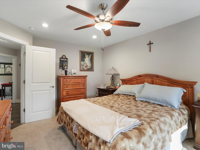 bedroom featuring light carpet and ceiling fan