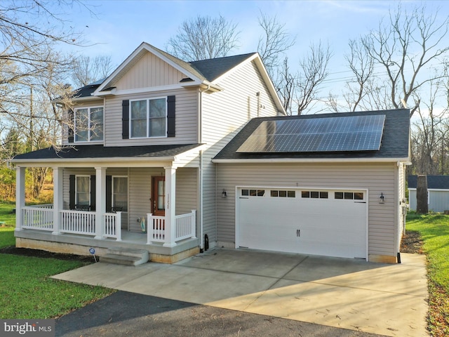 view of front of house with a porch, solar panels, and a garage