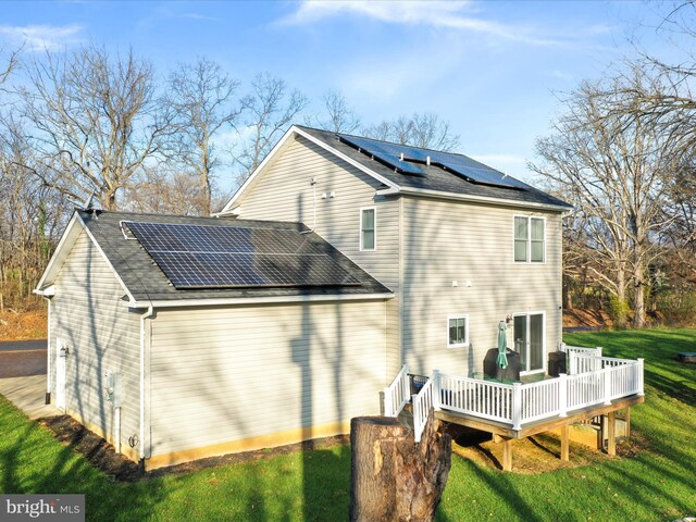 1150 Lewisville Rd, Berryville, VA 22611 - back of property featuring solar panels, a deck, a yard, and a shingled roof