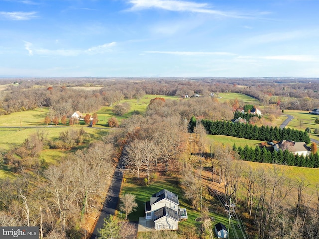 birds eye view of property with a rural view