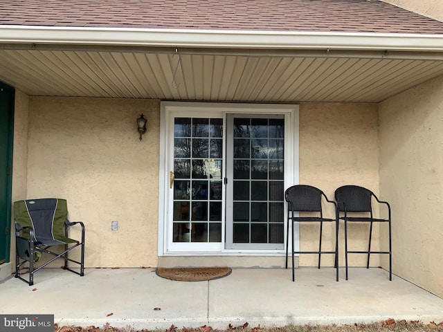 doorway to property with a patio