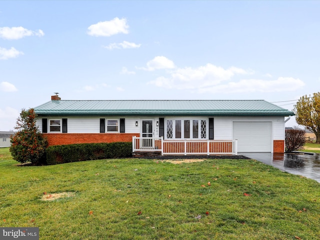 single story home with a garage and a front lawn