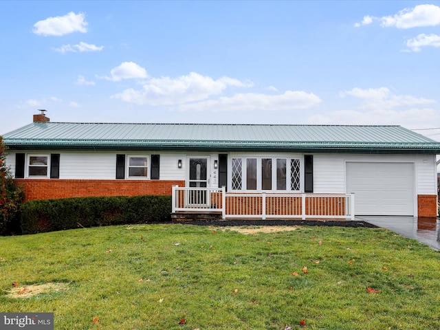 ranch-style home with a garage and a front lawn