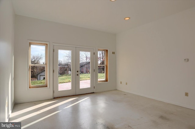 unfurnished room with french doors