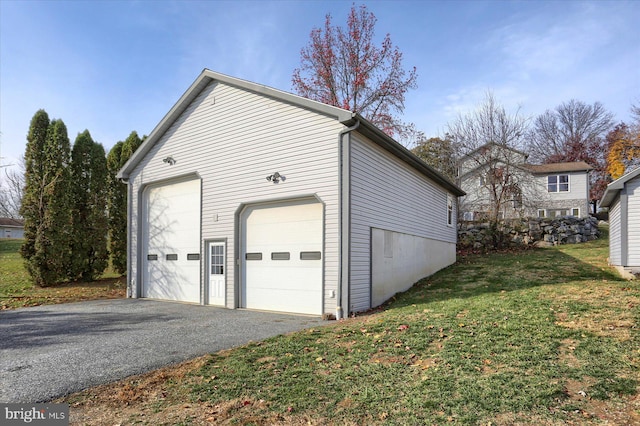 garage with a lawn