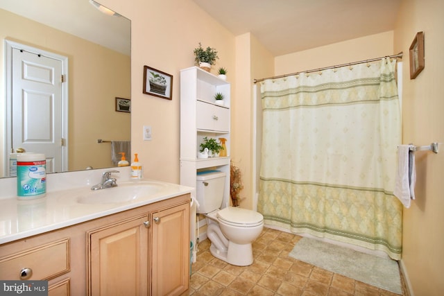 bathroom featuring vanity, toilet, and walk in shower