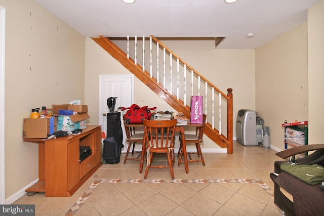 dining space featuring light tile patterned flooring