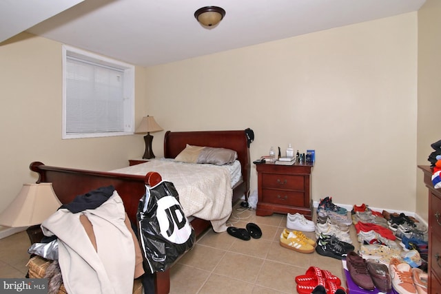 bedroom with light tile patterned flooring