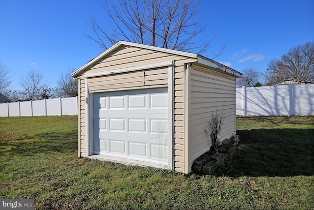 garage with a lawn