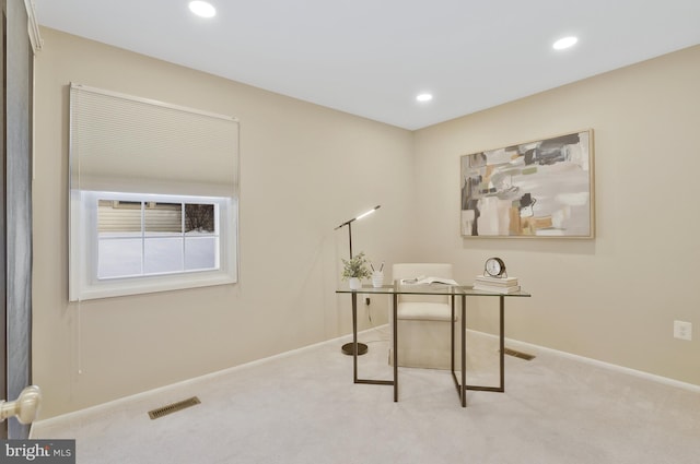 office area featuring light colored carpet