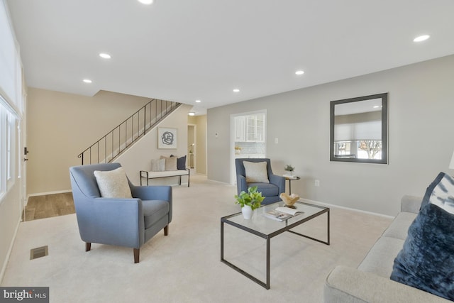 carpeted living room featuring a wealth of natural light