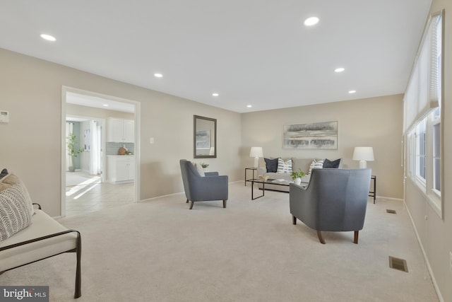 living room with light colored carpet