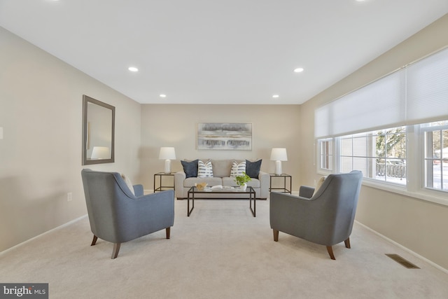 living room featuring light carpet