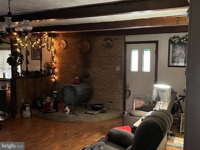 560 Frosty Hollow Rd, Fisher, WV 26818 - living room with wood finished floors, beam ceiling, and a chandelier