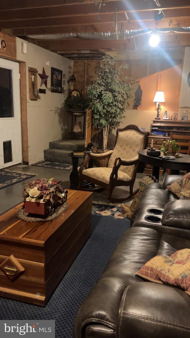 living room with beamed ceiling