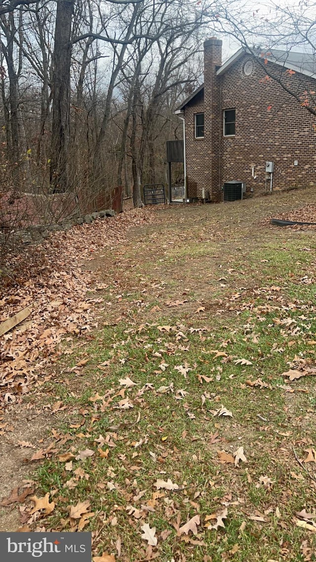 view of yard featuring central AC