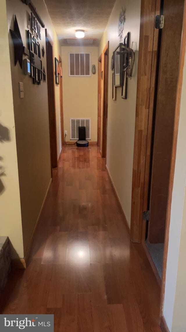 corridor with dark wood-type flooring