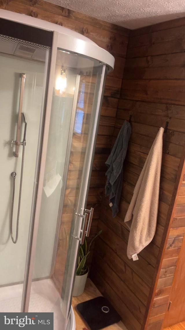 560 Frosty Hollow Rd, Fisher, WV 26818 - full bath with a shower stall, a textured ceiling, and wooden walls