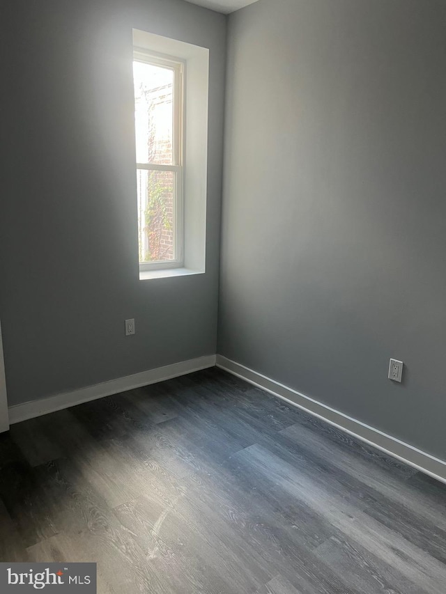 empty room featuring dark hardwood / wood-style floors