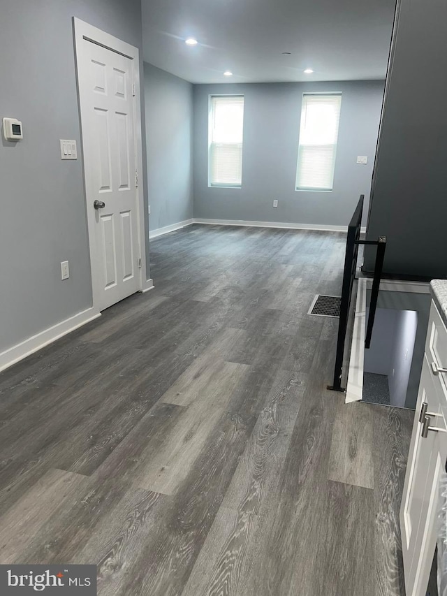 interior space with dark wood-type flooring