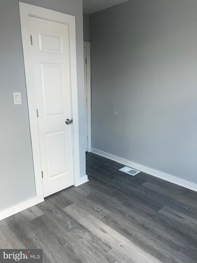 empty room featuring dark hardwood / wood-style floors