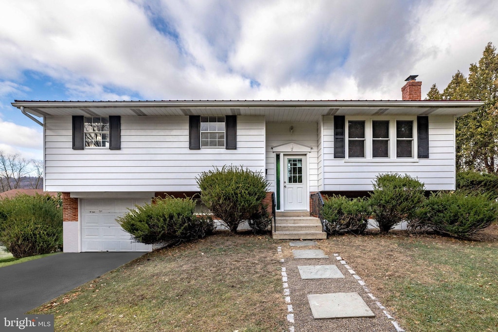 split foyer home featuring a garage