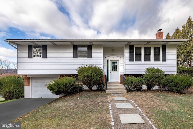 split foyer home featuring a garage