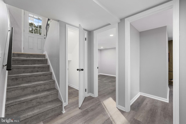 staircase featuring hardwood / wood-style floors