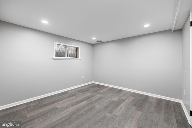 basement with hardwood / wood-style flooring