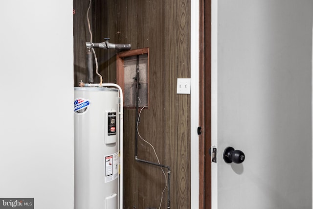 utility room with water heater