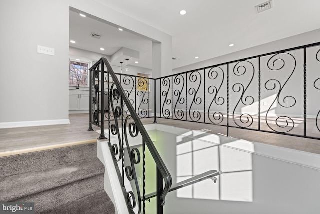 stairway with wood-type flooring