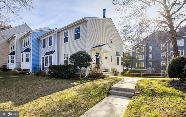 view of property featuring a front yard