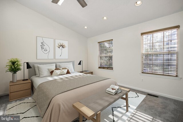 carpeted bedroom featuring ceiling fan and lofted ceiling