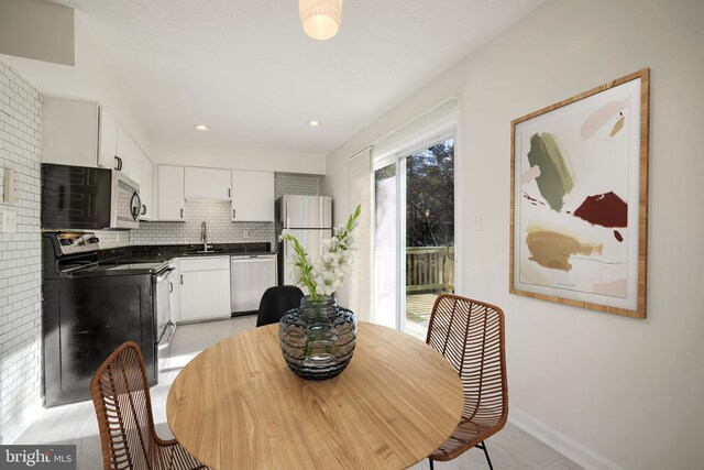 dining room featuring sink