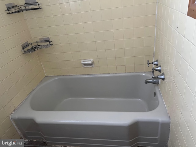 bathroom featuring a washtub