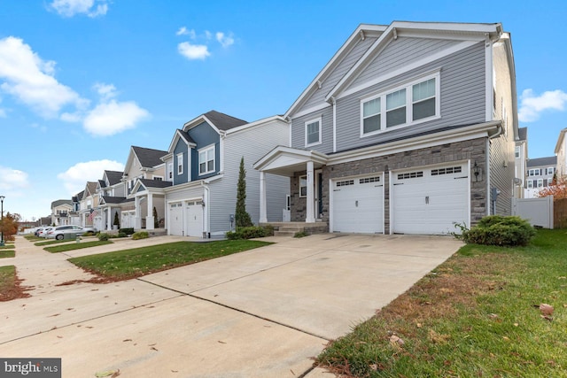 view of front of home featuring a garage and a front lawn