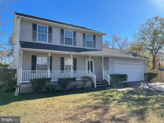 view of front facade with a front yard and a garage