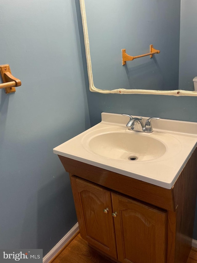 bathroom featuring hardwood / wood-style floors and vanity