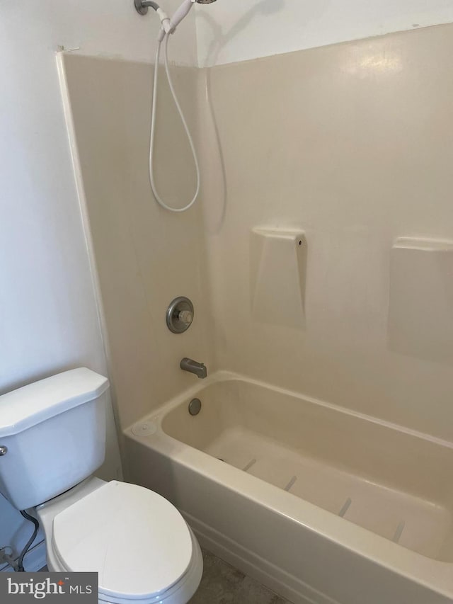 bathroom with toilet and tub / shower combination