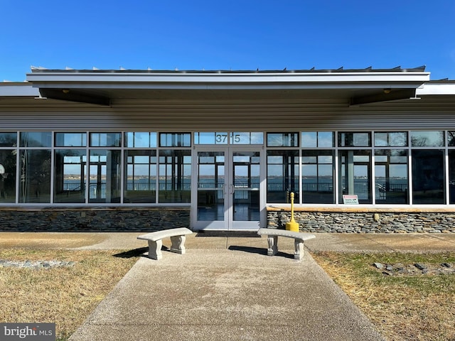 view of exterior entry featuring french doors