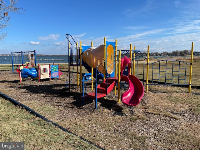 view of play area with a water view