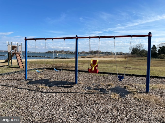 view of playground featuring a water view