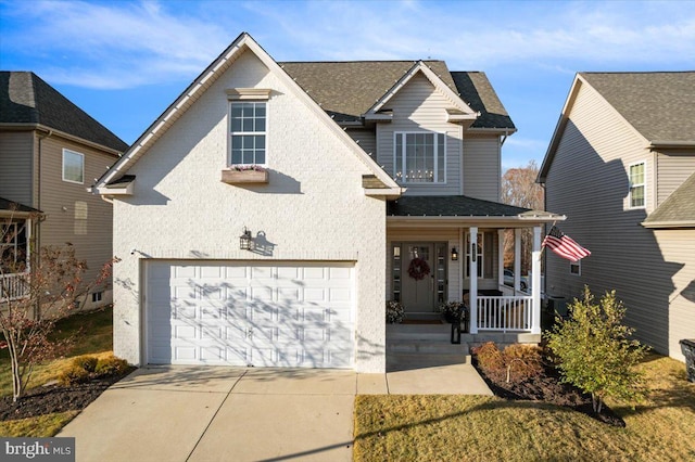 view of front of home featuring a porch and a garage