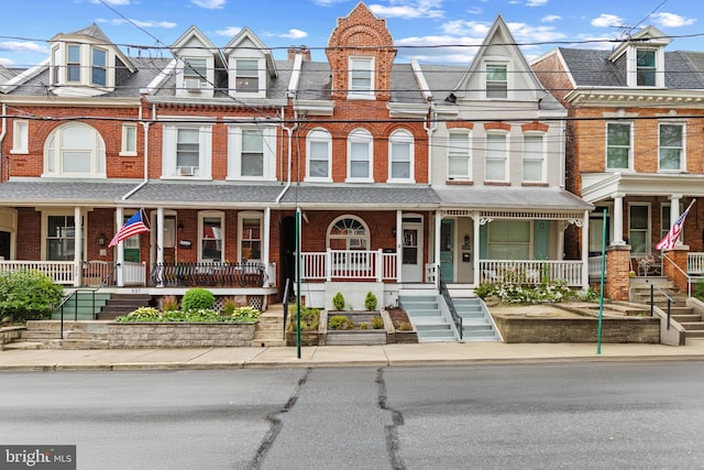 townhome / multi-family property with covered porch