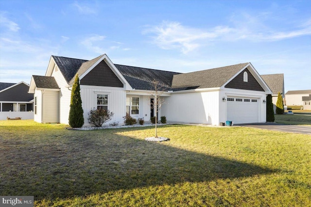 view of front facade with a front lawn and a garage