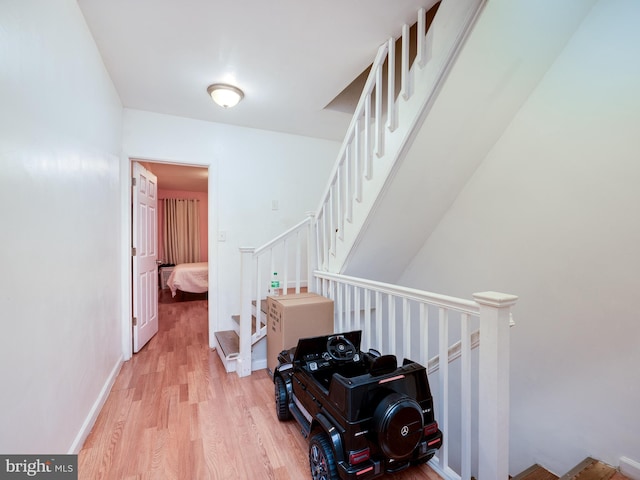 stairway with wood-type flooring